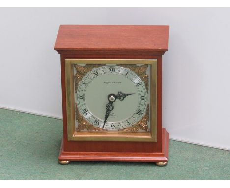 A Mappin and Webb mantel clock, walnut case, brass bun feet, made by Elliot, 15cm high