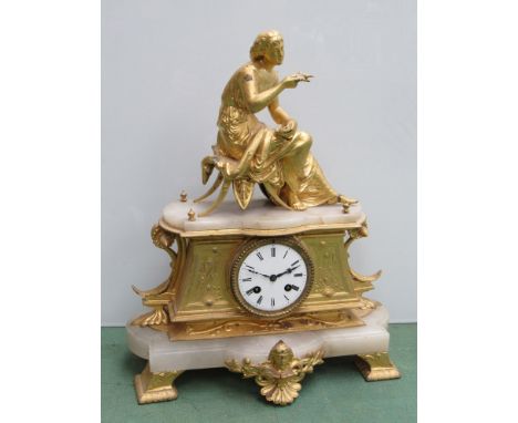 A French gilt and onyx mantel clock surmounted by a maiden with bird, Roman enamelled dial, 8 day movement, 41cm high