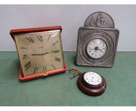 A leather cased travel alarm clock, pewter maritime desk clock and a pocket watch conversion piece (3)