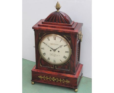 A Regency flame mahogany and brass inlaid bracket clock, painted metal Roman dial signed Springall, Norwich, brass acorn fini