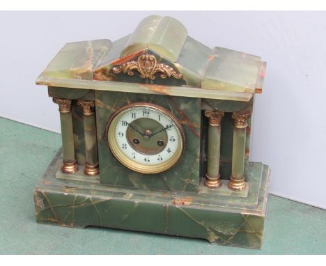 A green onyx mantel clock of architectural form, Arabic chapter ring, ormulu mounts, key and pendulum, 31cm high, a/f
