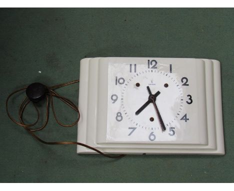 An Art Deco style Siemen's wall clock with electric movement, ceramic case