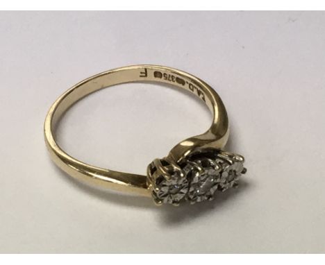 A 9ct gold ring inset with 3 diamonds. Ring size P