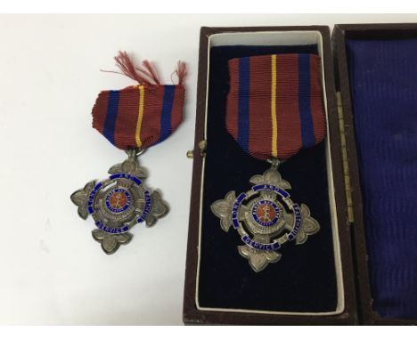 Two early 20th century silver and enamel Salvation Army medals. the reverse with inscription (2)