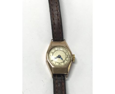 A vintage ladies 9ct gold watch on a leather strap