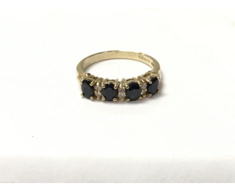 A 9ct gold ring set with alternating diamonds and sapphires. The approximate ring size is K.