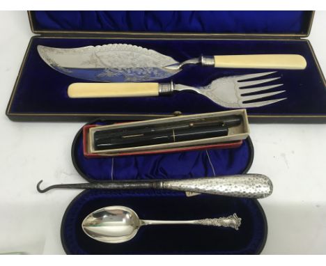 A cased silver spoon together with a boxed set of silver plated servers, a button hook And two pens