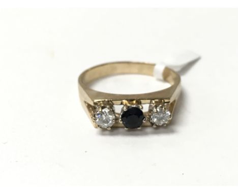 A sapphire and diamond three stone 9ct gold ring. The approximate ring size is between R and S.