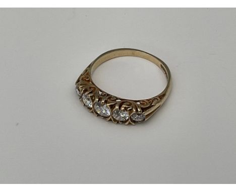 A 9ct gold ring set with 5 graduated CZ stones. Approx 2.4g, N  - NO RESERVE