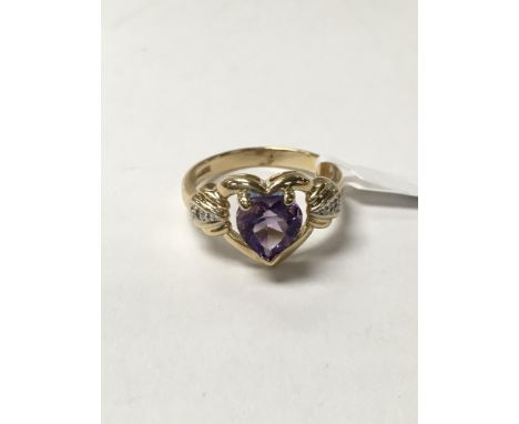 An amethyst and diamond set 14ct gold ring. The approximate ring size is K.