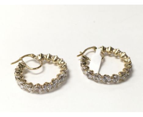 A pair of 9ct gold stone set hoops.