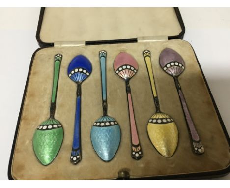 A cased set of six quality silver and multi coloured enamel tea spoons of Art Deco design Birmingham 1936 hallmarks. No obvio