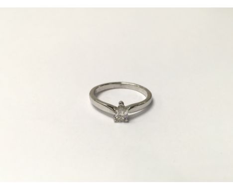 An 18ct white gold ring set with a solitaire pear shaped 0.25ct diamond. The approximate ring size is J.