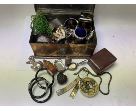 A brass casket with mixed contents of Jewellery and objet dâ€™art.