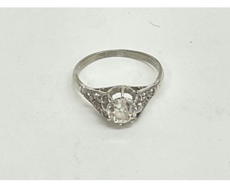 An 18ct white gold old cut solitaire ring. Approx 1ct