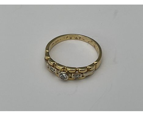 An 18ct gold Rolex design ring set with 3 diamonds. 4g, R.