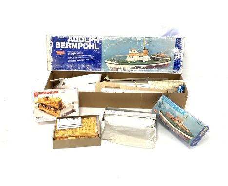 Graupner scale model boat kit 'Adolph Bermpohl No 2137, another boat kit 'Vegesack ' No 488 and an Ertl Caterpillar scale mod