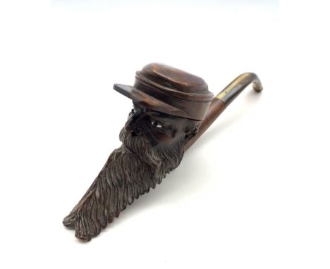 Early 20th century Briar pipe in the form of a bearded gentleman wearing a cap, inset glass eyes and curved horn stem and mou