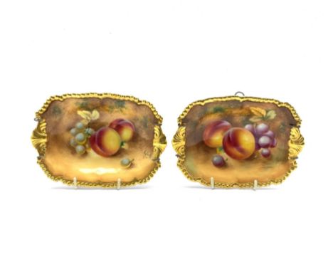 Pair of Royal Worcester hand painted rectangular dishes, each decorated with grapes and peaches within gilt gadrooned borders