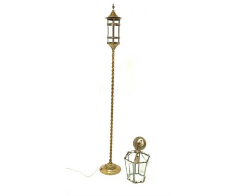 Early 20th century strapwork design brass lantern on barley twist brass column, H152cm together with a modern brass hall lant