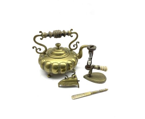 19th century small brass smoothing or lace box iron with trivet, a 19th century sleeve iron with carved bone handle, Thackray