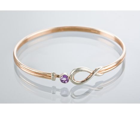 SHEILA FLEET BANGLE
in white and yellow gold, set with a single round amethyst, marked SD