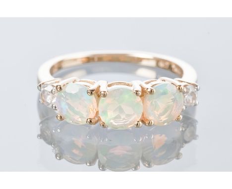 OPAL THREE STONE RING
set with three round faceted opals, set in nine carat gold, size L