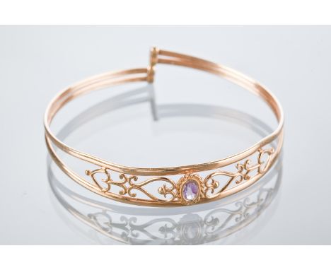 SHEILA FLEET NINE CARAT GOLD AMETHYST SET BANGLE
set with a single oval amethyst, marked SD