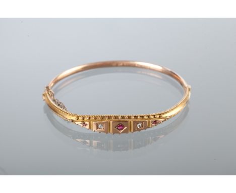 VICTORIAN RUBY AND DIAMOND BANGLE
set with three rubies, possibly synthetic, and two diamonds, marked 9CT for nine carat gold