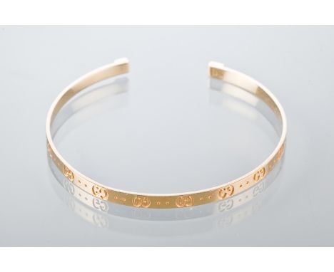 GUCCI EIGHTEEN CARAT GOLD BANGLE
embossed with the Gucci logo, with dust bag