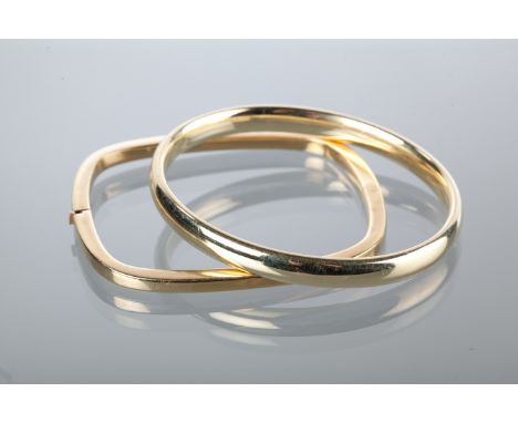 NINE CARAT GOLD BANGLE
of oval form; along with another bangle of rectangular form, unmarked, 20g gross (2)