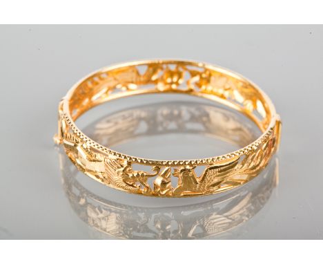 CHINESE HIGH CARAT GOLD BANGLE
decorated with a pierced dragon and cockerel design, unmarked but tests as high carat gold, 60