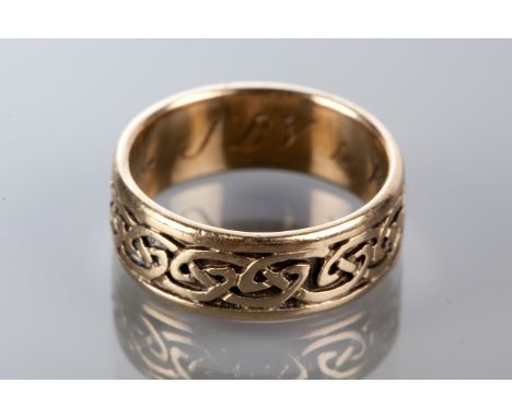 NINE CARAT GOLD RING BY SHEILA FLEET
with scrolling Celtic design, with SD marks, size O