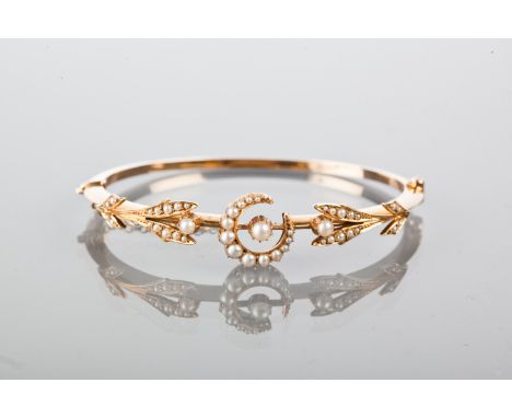 EDWARDIAN SEED PEARL SET BANGLE
openwork and with a central crescent motif, unmarked, in a fitted case
