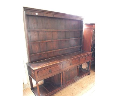 A 19th Century shelf back dresser with three drawers, single cupboard and pot board (later added back)