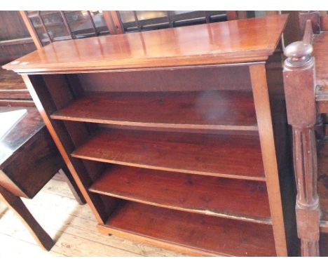 A mahogany four shelf bookcase