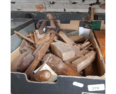 A box of old tools and tool parts -mainly wooden parts from planes 