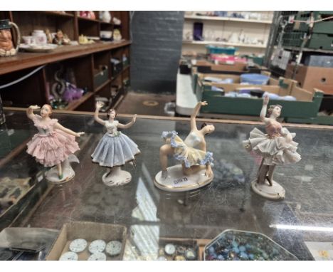 Four Dresden ceramic balerina figures. 
