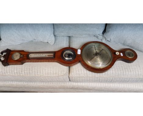A vintage barometer/thermometer 