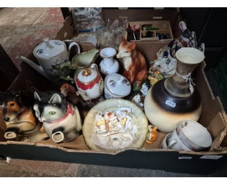 A box containing various ornaments including Beswick beagle, ceramic animals, novelty teapots, ceramic dog band, etc.