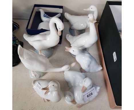 Seven Nao geese figurines and one other. 