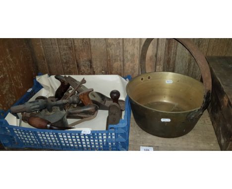 A box of vintage tools to include planes etc. and a brass jam pan. 