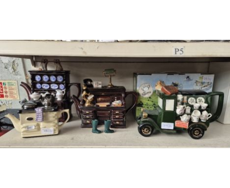 Four novelty ceramic teapots.