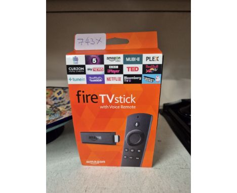 An Amazon Fire TV Stick with voice remote. 