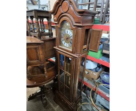 A Hermle triple weight chiming longcase clock. 