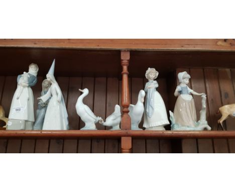 3 Lladro porcelain figurines - a sitting girl with calla lilies (no.4972) designed by Vincente Martinez and issued 1977-88, G