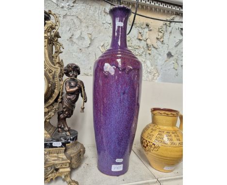 A large purple glazed ceramic vase, height 56cm. Condition- good, no sign of any damage or repairs.