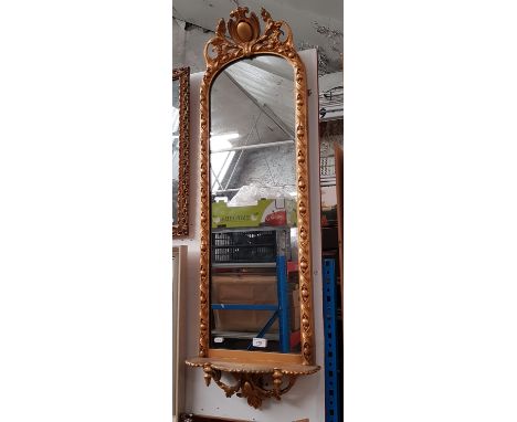 A 19th century Continental gilt framed mirror with shelf, 115cm x 38cm (overall)