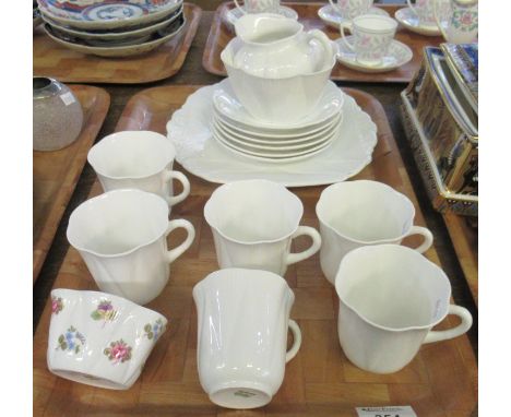 Shelley English fine bone china part teaset in scalloped floral design to include; teacups, milk jug, sucrier, serving plate 