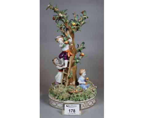 Von Schierholz porcelain figure group of children picking apples from a tree with a ladder on naturalistic base, printed mark